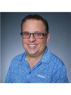 Joel E. Feuer - RE/MAX Town & Country